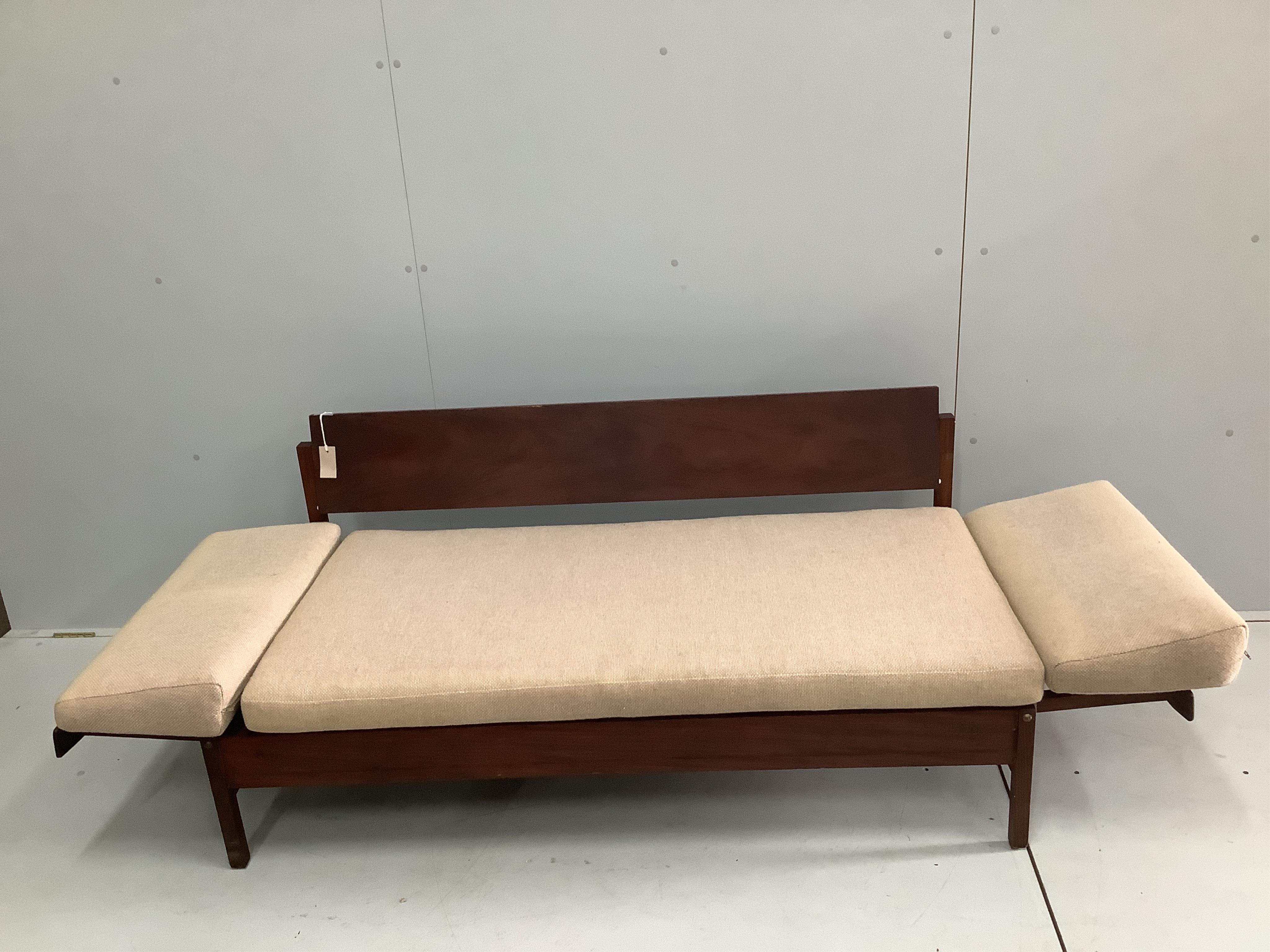 A mid century Robin Day style teak sofa bed, width 149cm, depth 72cm, height 68cm. Condition - poor